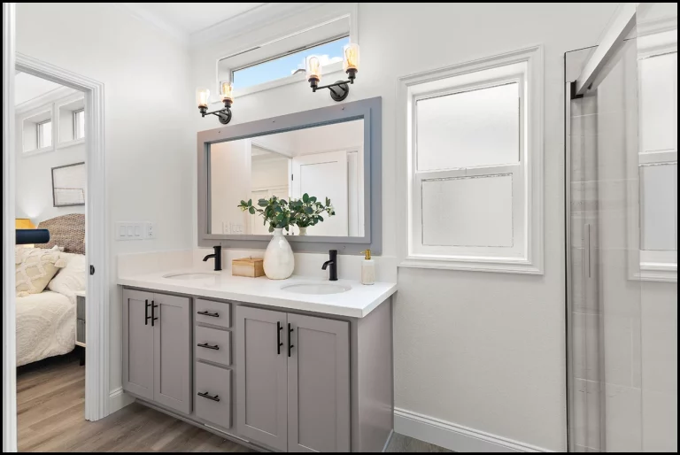 a bathroom with a mirror and sink