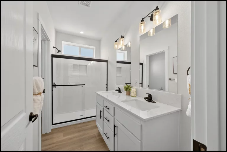 a bathroom with a shower and a sink
