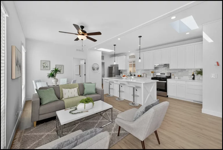 a living room with a kitchen and dining area