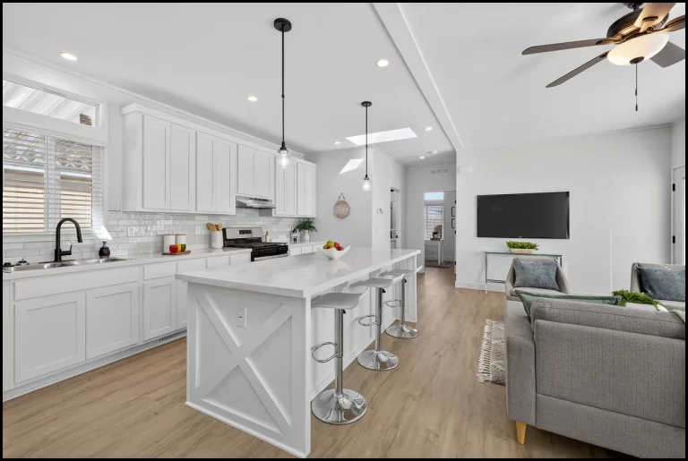 a kitchen and living room with a television