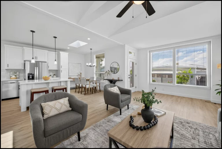 a living room with a table and chairs