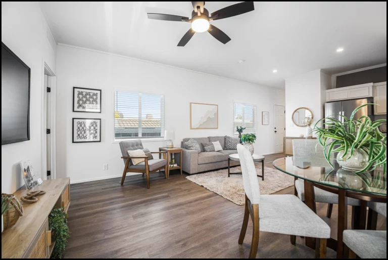 a living room with a table and chairs
